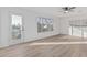 Bright bedroom featuring a balcony, large window, and light wood flooring at 2712 W Oakgrove Ln, Chandler, AZ 85224
