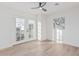 Light-filled bedroom with wood floors and double french doors leading to the outside at 2712 W Oakgrove Ln, Chandler, AZ 85224