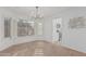 Bright dining room boasts natural light, and a modern light fixture at 2712 W Oakgrove Ln, Chandler, AZ 85224