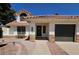 Inviting home exterior features a tile roof, landscaped front yard, and a convenient two-car garage at 2712 W Oakgrove Ln, Chandler, AZ 85224
