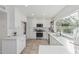 Bright kitchen with white cabinets, stainless appliances, and a view of the backyard at 2712 W Oakgrove Ln, Chandler, AZ 85224