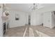 Bright living room featuring tile floors, fireplace, and modern light fixture at 2712 W Oakgrove Ln, Chandler, AZ 85224