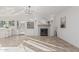 Open living room featuring a decorative fireplace with built-in storage at 2712 W Oakgrove Ln, Chandler, AZ 85224