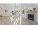 Open-concept living area with fireplace that flows into the bright kitchen at 2712 W Oakgrove Ln, Chandler, AZ 85224