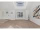 Bright living room features a skylight and carpet at 2712 W Oakgrove Ln, Chandler, AZ 85224