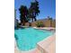 Backyard pool with an integrated waterfall feature, offering a tranquil outdoor oasis at 2712 W Oakgrove Ln, Chandler, AZ 85224