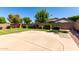 Backyard with block wall, lawn, landscaping and concrete patio at 2732 E Tyson St, Chandler, AZ 85225
