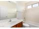 Well-lit bathroom features a single vanity, a full mirror, and a shower-tub combo with neutral-toned walls at 2732 E Tyson St, Chandler, AZ 85225