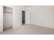 A view of a carpeted bedroom with a closet at 2732 E Tyson St, Chandler, AZ 85225