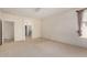 Bedroom with carpet, neutral walls, and a doorway to the bathroom at 2732 E Tyson St, Chandler, AZ 85225