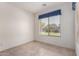 Sunny bedroom featuring tile floors, a large window, and neutral paint at 2732 E Tyson St, Chandler, AZ 85225