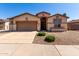 Inviting home featuring a well-maintained front yard, neutral paint scheme, and convenient two-car garage at 2732 E Tyson St, Chandler, AZ 85225