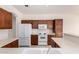 Traditional kitchen features white appliances, cabinetry, countertops, and functional layout at 2732 E Tyson St, Chandler, AZ 85225