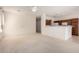 Expansive living area offers neutral paint, white trim, an eat-in kitchen bar and view to kitchen at 2732 E Tyson St, Chandler, AZ 85225