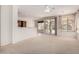 Open-concept living space showcases neutral paint, white trim, and seamless access to the outdoors at 2732 E Tyson St, Chandler, AZ 85225