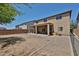 Spacious backyard with covered patio and low-maintenance landscaping at 30263 W Crittenden Ln, Buckeye, AZ 85396
