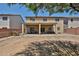 Large backyard showcasing a covered patio and view of home at 30263 W Crittenden Ln, Buckeye, AZ 85396