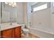 Bathroom features a shower-tub combo, updated fixtures and ample lighting above the sink at 30263 W Crittenden Ln, Buckeye, AZ 85396