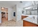 Bathroom with double vanity, separate room with toilet, and extra cabinet at 30263 W Crittenden Ln, Buckeye, AZ 85396