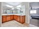 Bathroom with double vanity and separate room with a toilet at 30263 W Crittenden Ln, Buckeye, AZ 85396