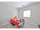 Bedroom with neutral carpeting and a large window allowing natural light at 30263 W Crittenden Ln, Buckeye, AZ 85396