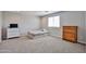 Cozy bedroom featuring neutral tones, a twin bed, and a dresser for a minimalist yet comfortable space at 30263 W Crittenden Ln, Buckeye, AZ 85396