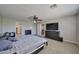 Bedroom with ceiling fan and connected to the hallway and another room at 30263 W Crittenden Ln, Buckeye, AZ 85396