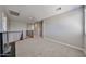Upstairs hallway has neutral-colored carpet and gray walls and railing at 30263 W Crittenden Ln, Buckeye, AZ 85396