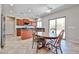Charming kitchen featuring an island, dark countertops, wood cabinets, and stainless steel appliances at 30263 W Crittenden Ln, Buckeye, AZ 85396