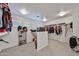 Spacious walk-in closet with custom shelving, racks and safe at 30263 W Crittenden Ln, Buckeye, AZ 85396