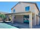 Spacious backyard with covered patio, a glimpse of the pool, and mature landscaping at 3502 W Belle Ave, San Tan Valley, AZ 85144
