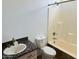 Bathroom featuring a shower-tub combo, granite countertop, and updated fixtures at 3502 W Belle Ave, San Tan Valley, AZ 85144
