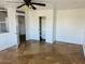 Spacious bedroom with neutral tile flooring, closet, storage space and an open doorway at 3502 W Belle Ave, San Tan Valley, AZ 85144