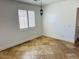 A living room featuring tile flooring, large window and lantern lighting at 3502 W Belle Ave, San Tan Valley, AZ 85144