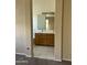 Bathroom featuring double sinks with wood cabinets, tile floor, and a large mirror at 3633 E Potter Dr, Phoenix, AZ 85050