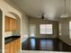 Open-concept living room featuring wood cabinets, dark wood floors, and natural light at 3633 E Potter Dr, Phoenix, AZ 85050