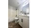 This bathroom has a single vanity, a mirror, tile flooring, and a shower/tub combo at 37061 W Bello Ln, Maricopa, AZ 85138