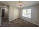 Bedroom featuring carpet, a window, and a ceiling fan, creating a cozy and inviting atmosphere at 37061 W Bello Ln, Maricopa, AZ 85138