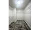 This closet has tile flooring, wire shelving, and white walls at 37061 W Bello Ln, Maricopa, AZ 85138