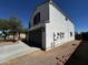 Two-story home featuring an attached two-car garage and a well-maintained front yard at 37061 W Bello Ln, Maricopa, AZ 85138