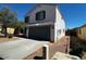 Two-story home featuring an attached two-car garage and a well-maintained front yard at 37061 W Bello Ln, Maricopa, AZ 85138