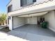 Two-car garage with ample space and an overhead door at 37061 W Bello Ln, Maricopa, AZ 85138