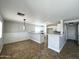 Open concept living room and kitchen area features updated finishes at 37061 W Bello Ln, Maricopa, AZ 85138