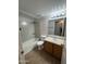 A bright bathroom featuring a tub and shower combination and vanity at 4231 N 69Th Dr # 1297, Phoenix, AZ 85033