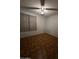 This is a quaint bedroom with parquet flooring and a ceiling fan at 4231 N 69Th Dr # 1297, Phoenix, AZ 85033