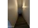 An interior shot of a stairwell with neutral-colored walls and stairs at 4231 N 69Th Dr # 1297, Phoenix, AZ 85033