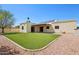 Nice backyard with desert landscaping, solar panels, and a covered patio at 4231 W Villa Maria Dr, Glendale, AZ 85308