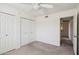 Bright bedroom featuring a ceiling fan and closet with folding doors at 4231 W Villa Maria Dr, Glendale, AZ 85308