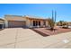 This home has a two-car garage, desert landscaping, and is conveniently located on a paved street at 4231 W Villa Maria Dr, Glendale, AZ 85308