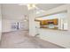 The living room is open to the kitchen with a breakfast bar, perfect for entertaining at 4231 W Villa Maria Dr, Glendale, AZ 85308